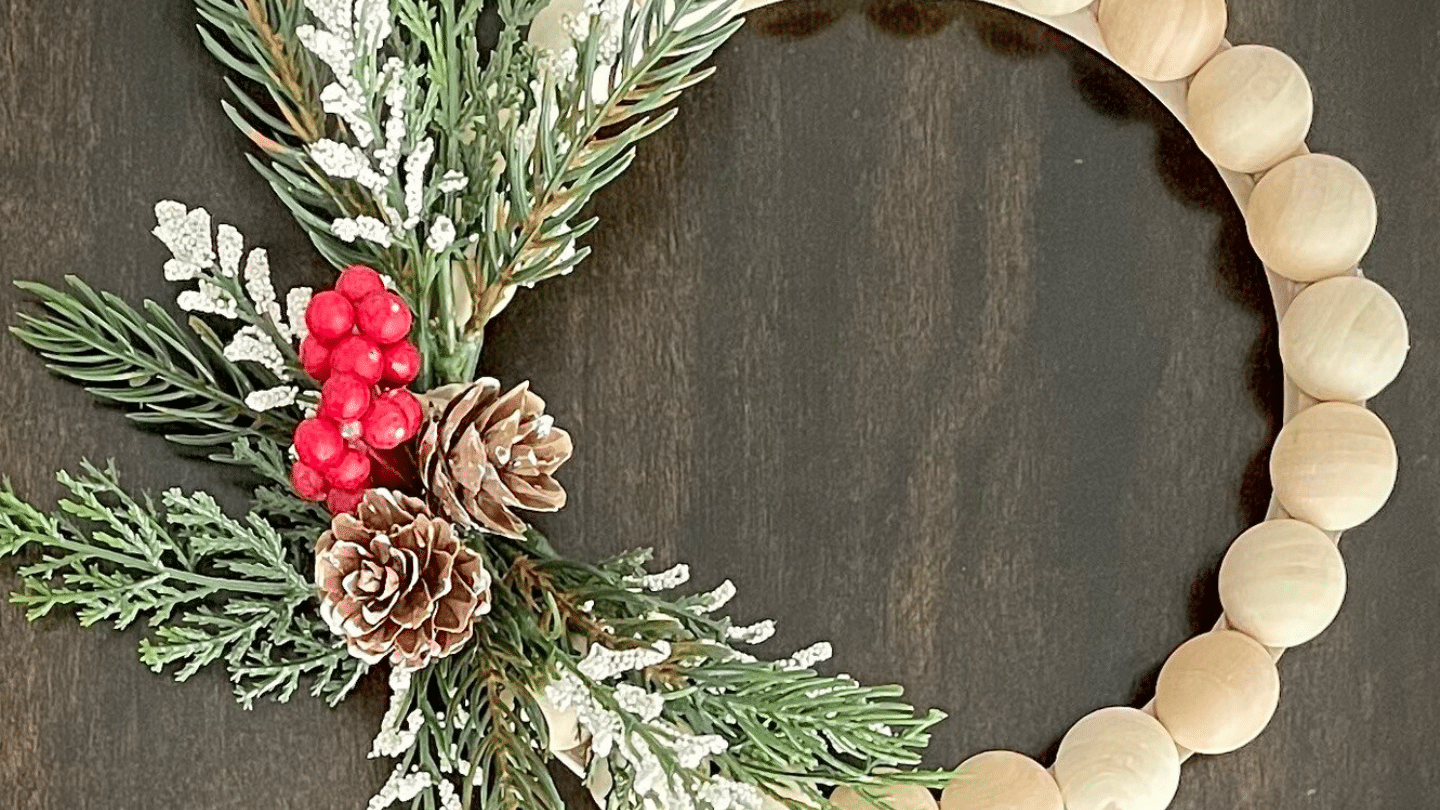 Wood_Bead_Wreath_with_Pinecone_and_Red_Berry_Accent