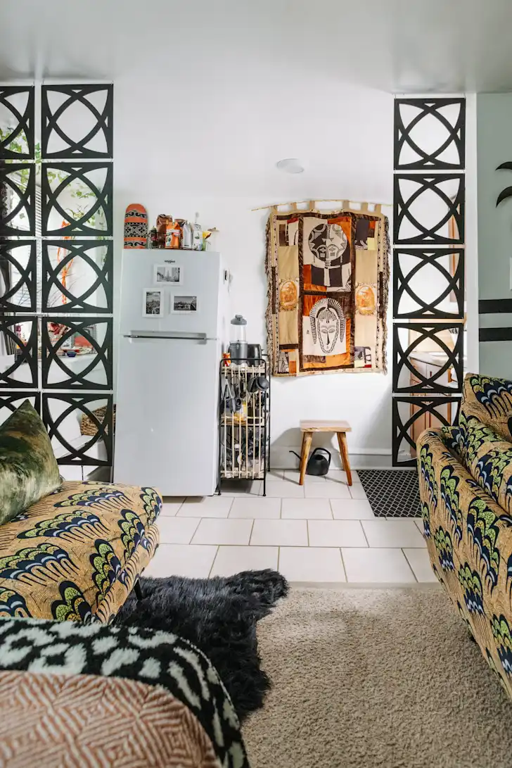 Tapestry wall hanging in a compact living space.