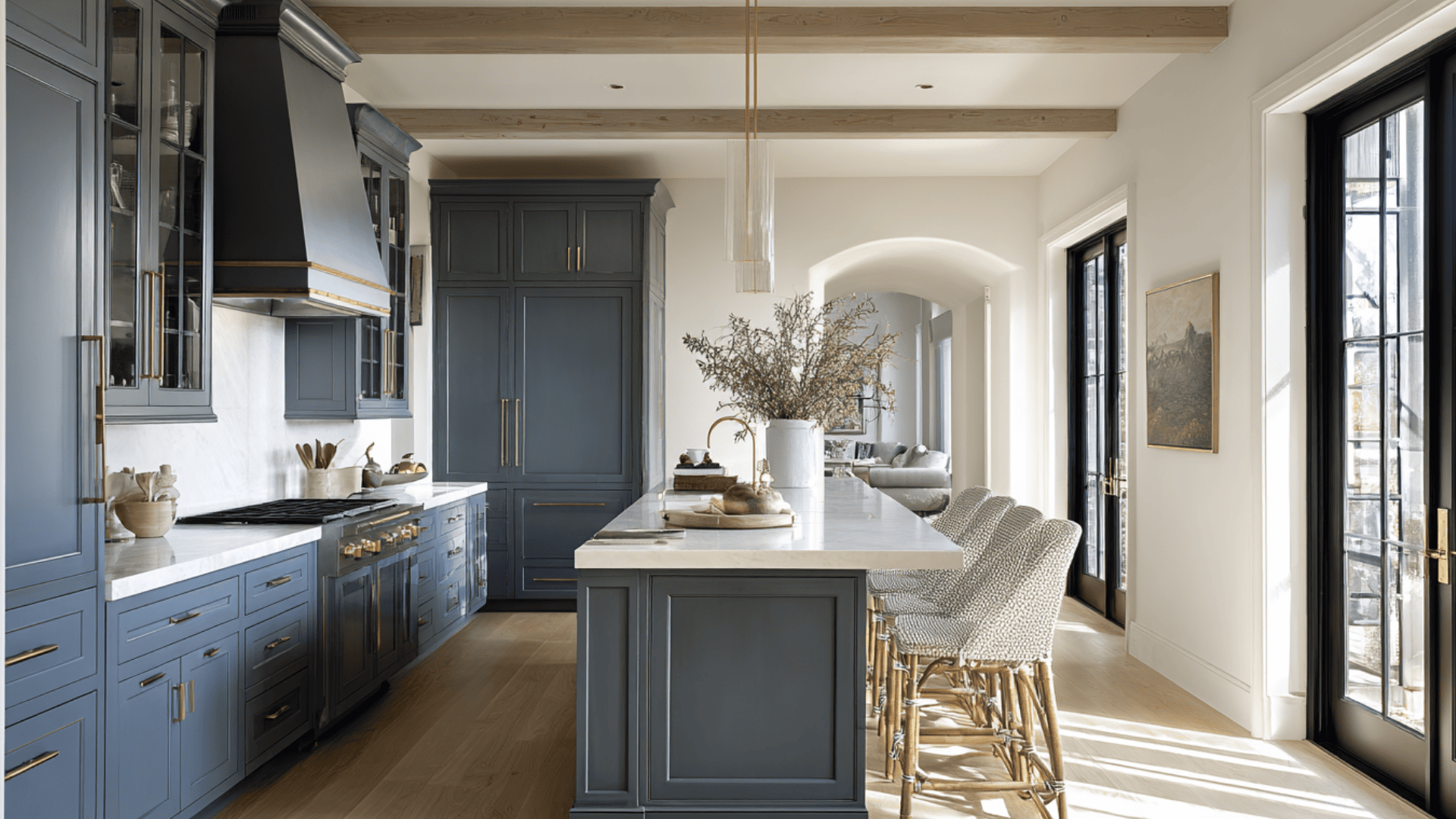A kitchen featuring blue cabinets and a warm wooden ceiling, creating a cozy and inviting atmosphere.A bright kitchen featuring a large window and elegant wooden cabinets.