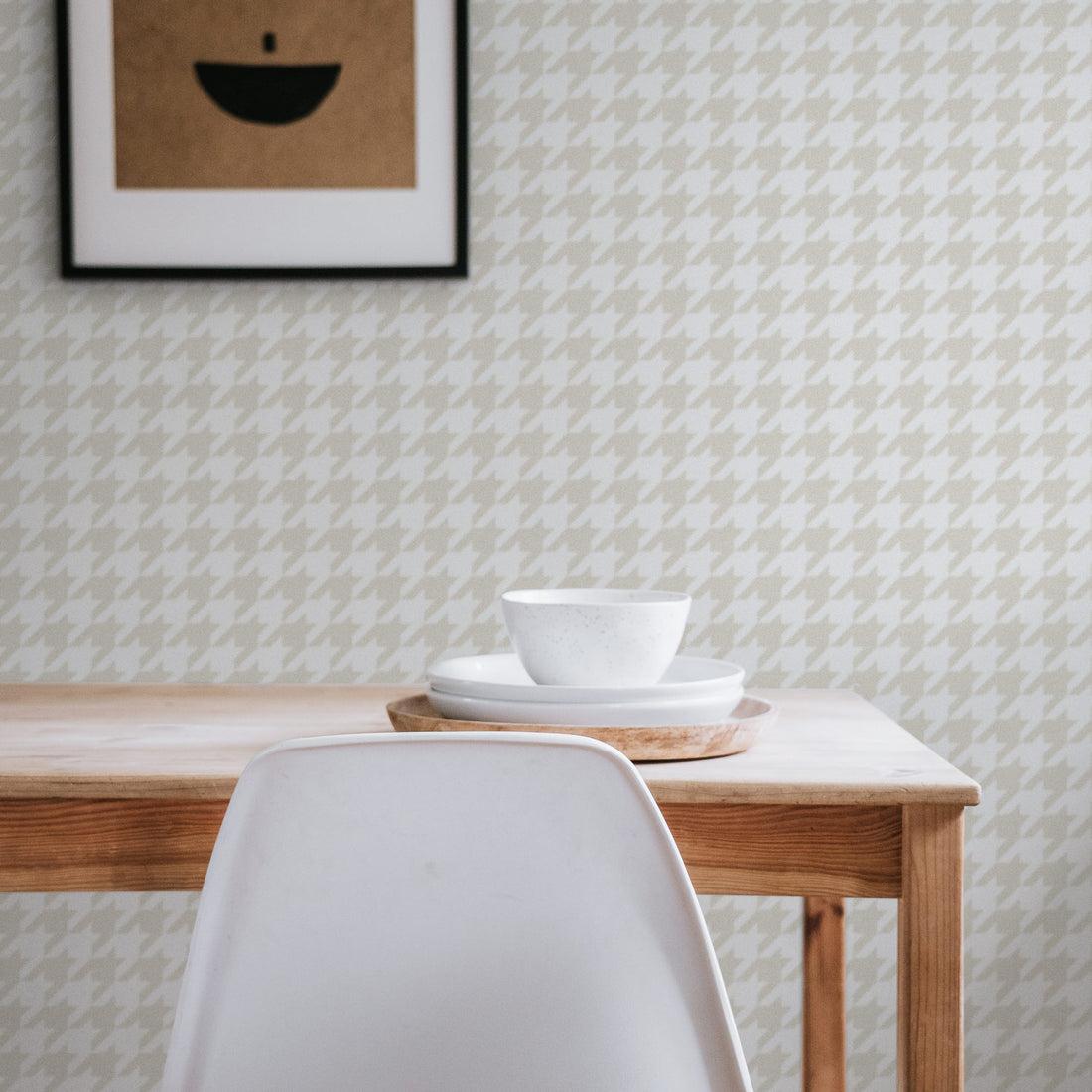 Dining room with a bold patterned peel and stick wallpaper accent wall, natural wood table, warm neutral surroundings