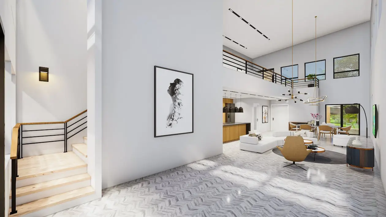 Spacious modern living room with staircase, abstract wall art, and large windows in bright natural light