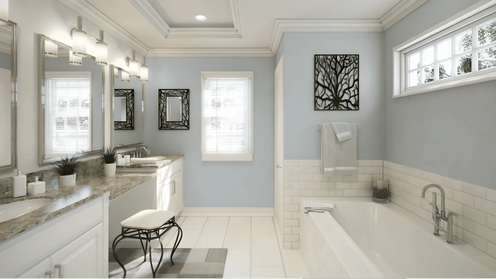 Bright bathroom with soft blue walls, white vanity, mirrors, bathtub, and clean modern design