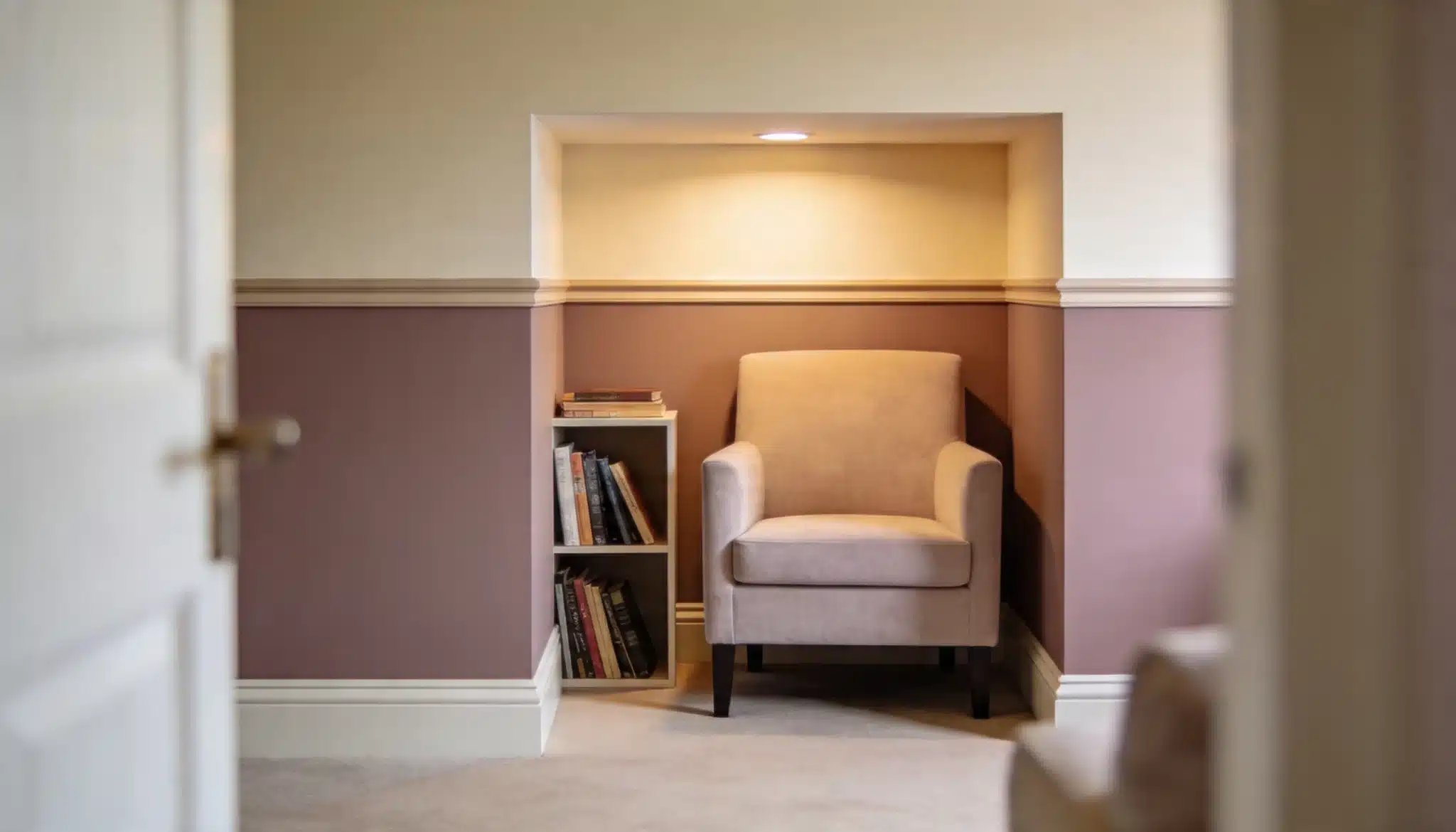 Cozy reading nook with two-tone wall in Swiss Coffee cream and Pashmina taupe tones