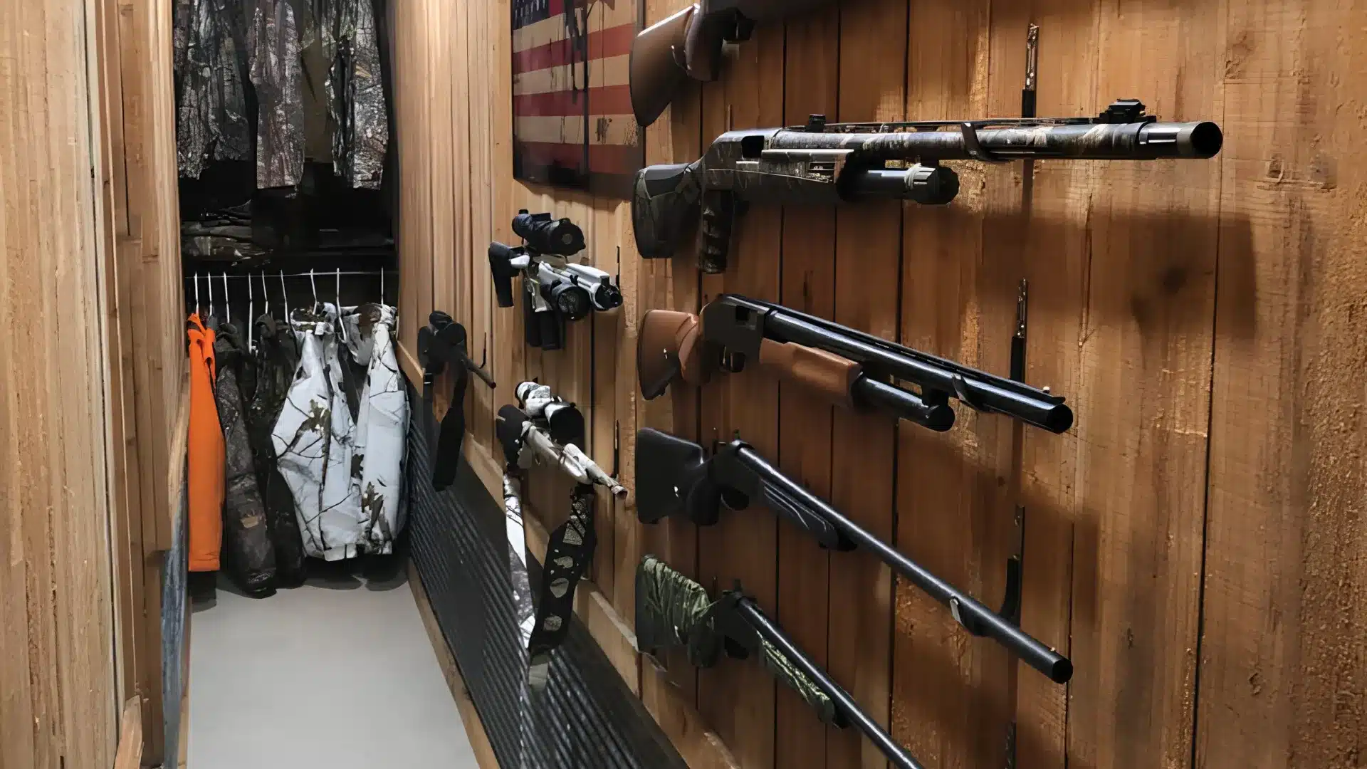 Hunting gear, including various firearms mounted on a wood-paneled narrow space