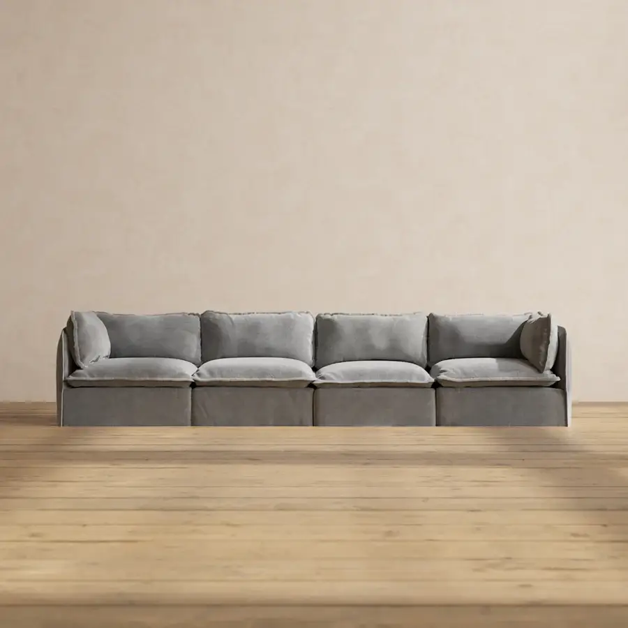 Gray sectional sofa in minimalist living room with light wood flooring and beige walls