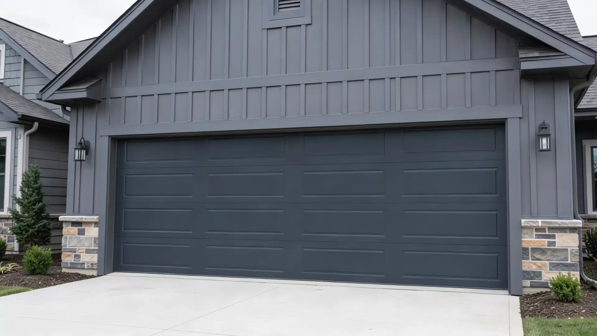 A residential home with an attached garage and a clear driveway leading to the entrance