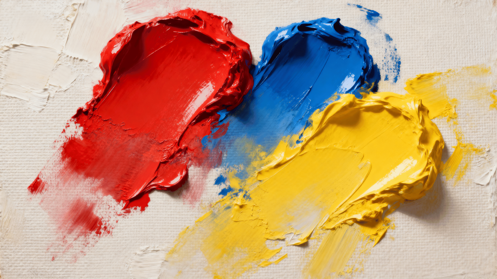 real acrylic painting on canvas showing the primary colors red, blue, and yellow with thick brush strokes and visible paint texture