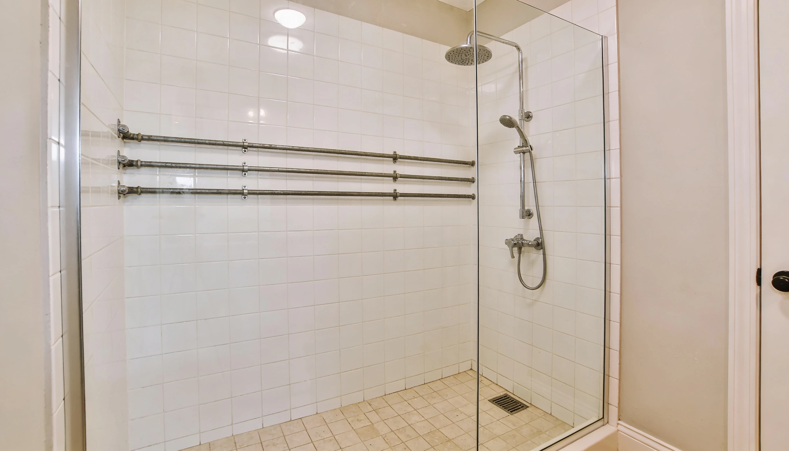 walk in shower using existing plumbing layout in small bathroom renovation