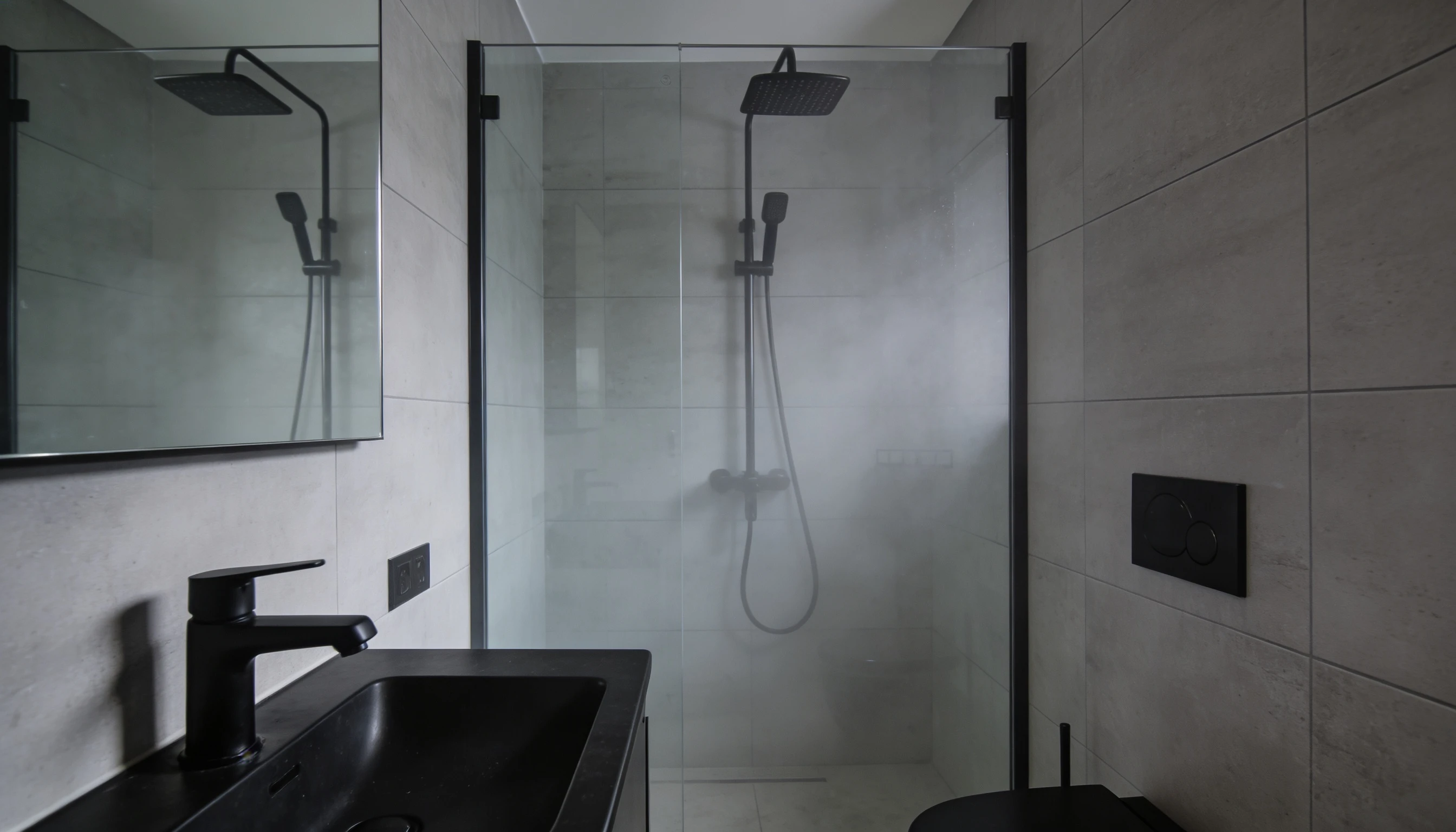 walk in shower with matte black fixtures in small bathroom modern style