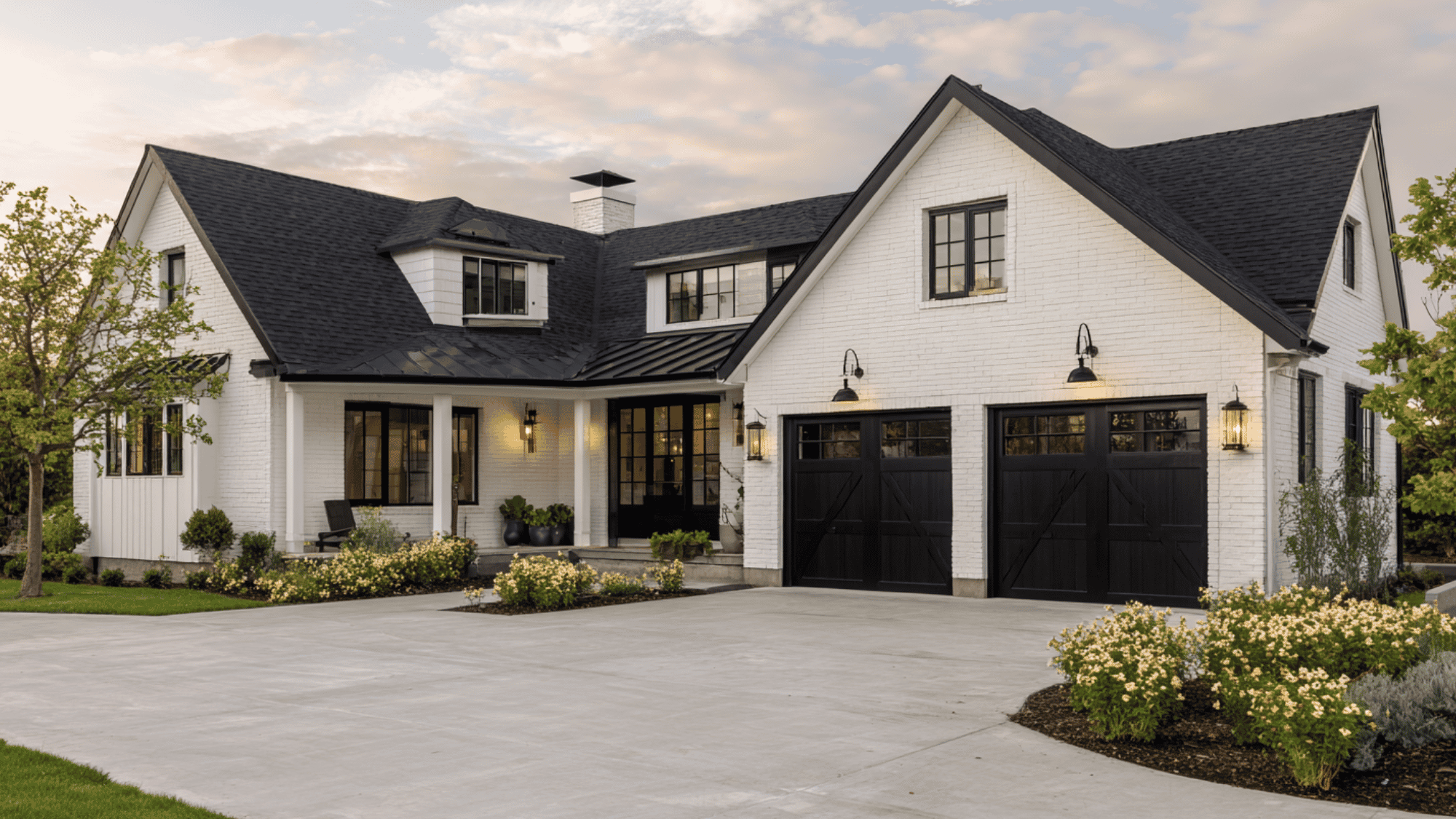 white brick house with black trim and farmhouse curb appeal