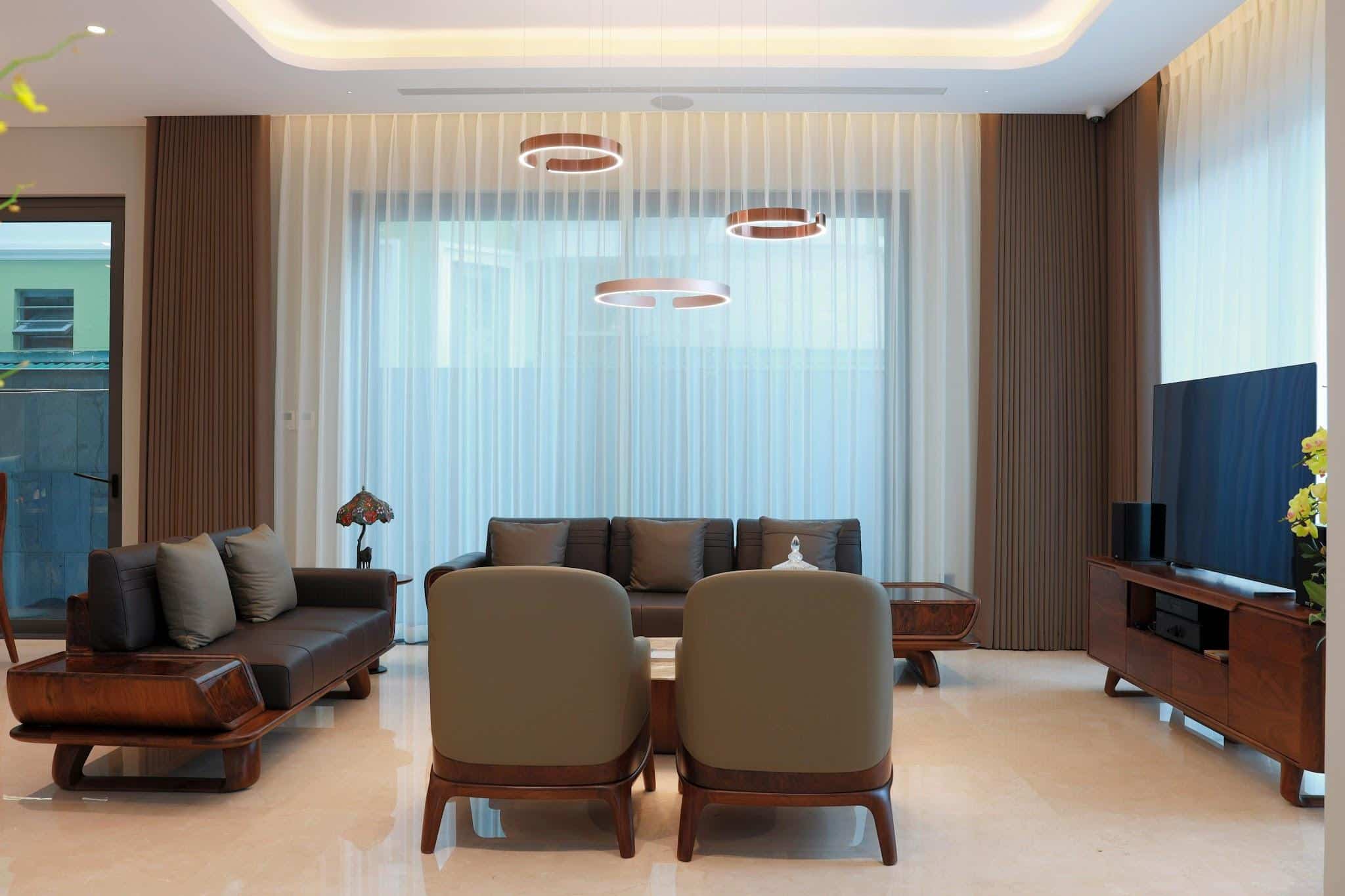 A modern living room with minimalist furniture and soft lighting.