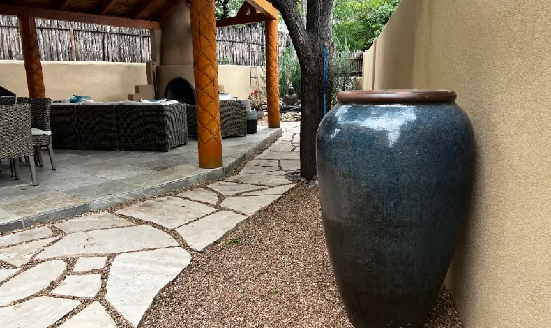 Patio with a large ceramic vase.