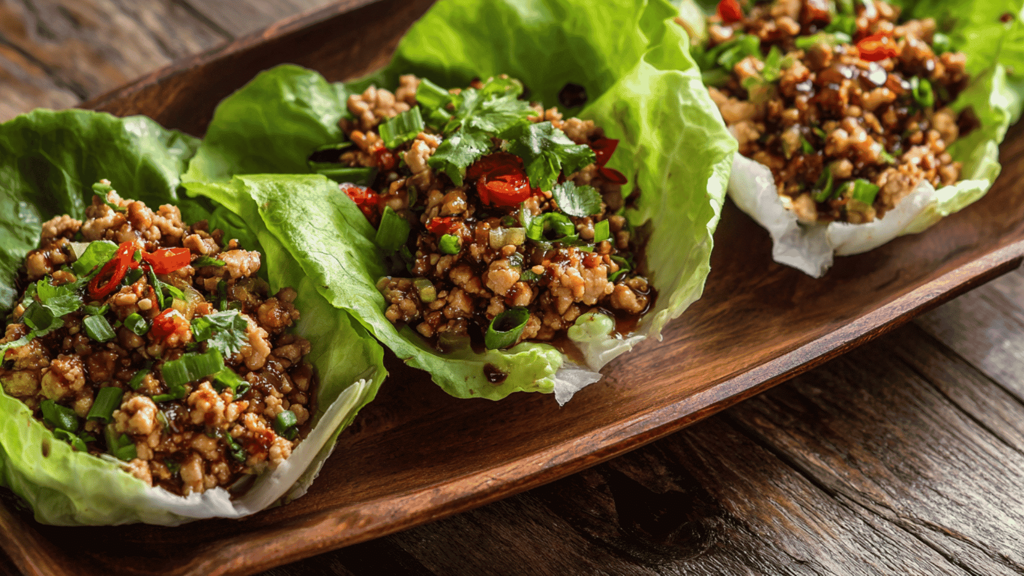 Savory ground chicken with garlic, ginger, and hoisin sauce in crisp butter lettuce cups.