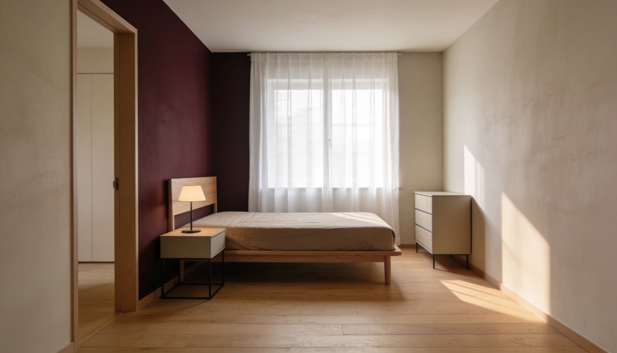 Bedroom with a queen bed, bedside table with lamp, and a dresser in front of a textured wall.