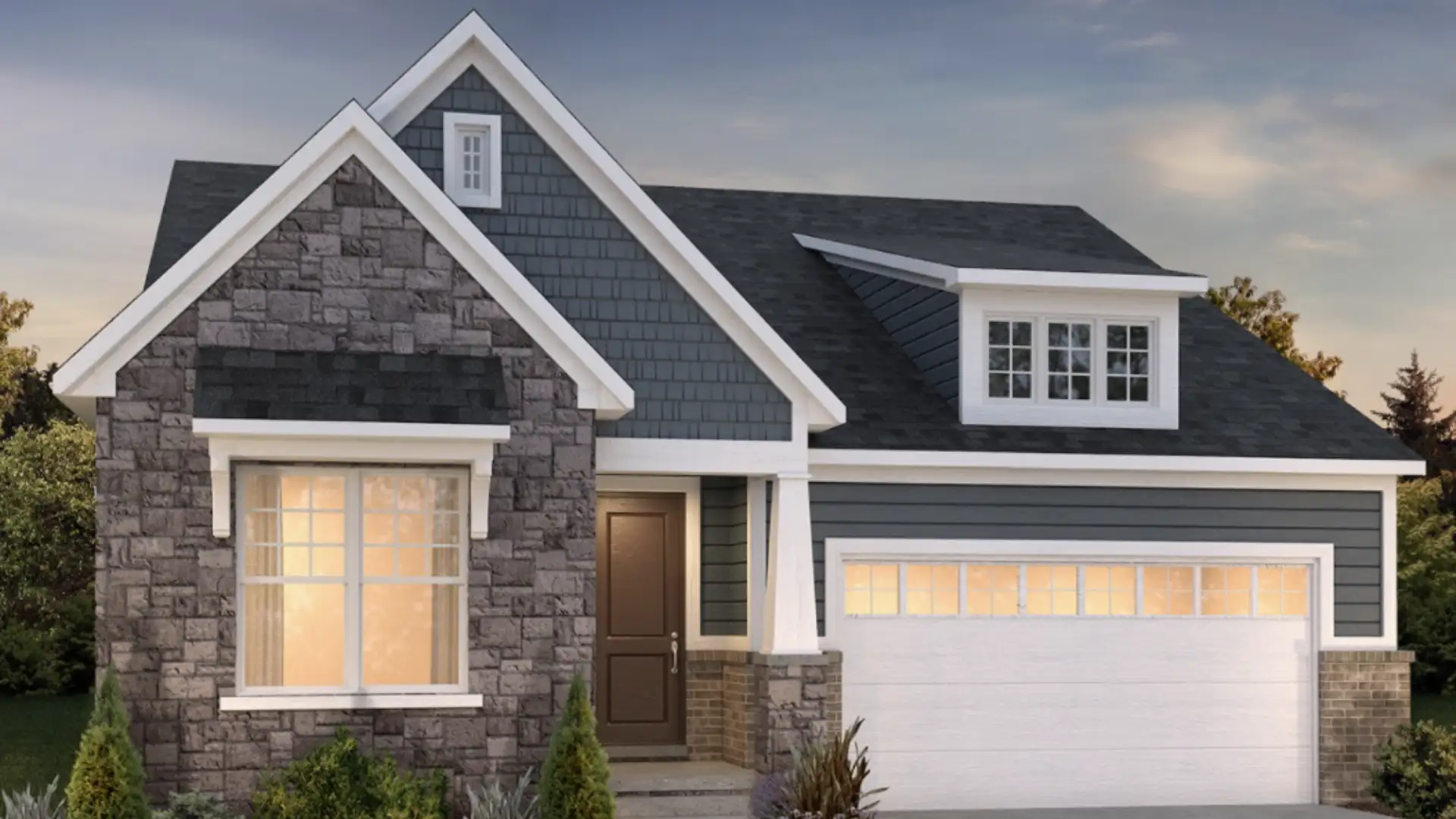 A modern house with stone and gray siding, a white garage door, and a brown front door under a cloudy sky.