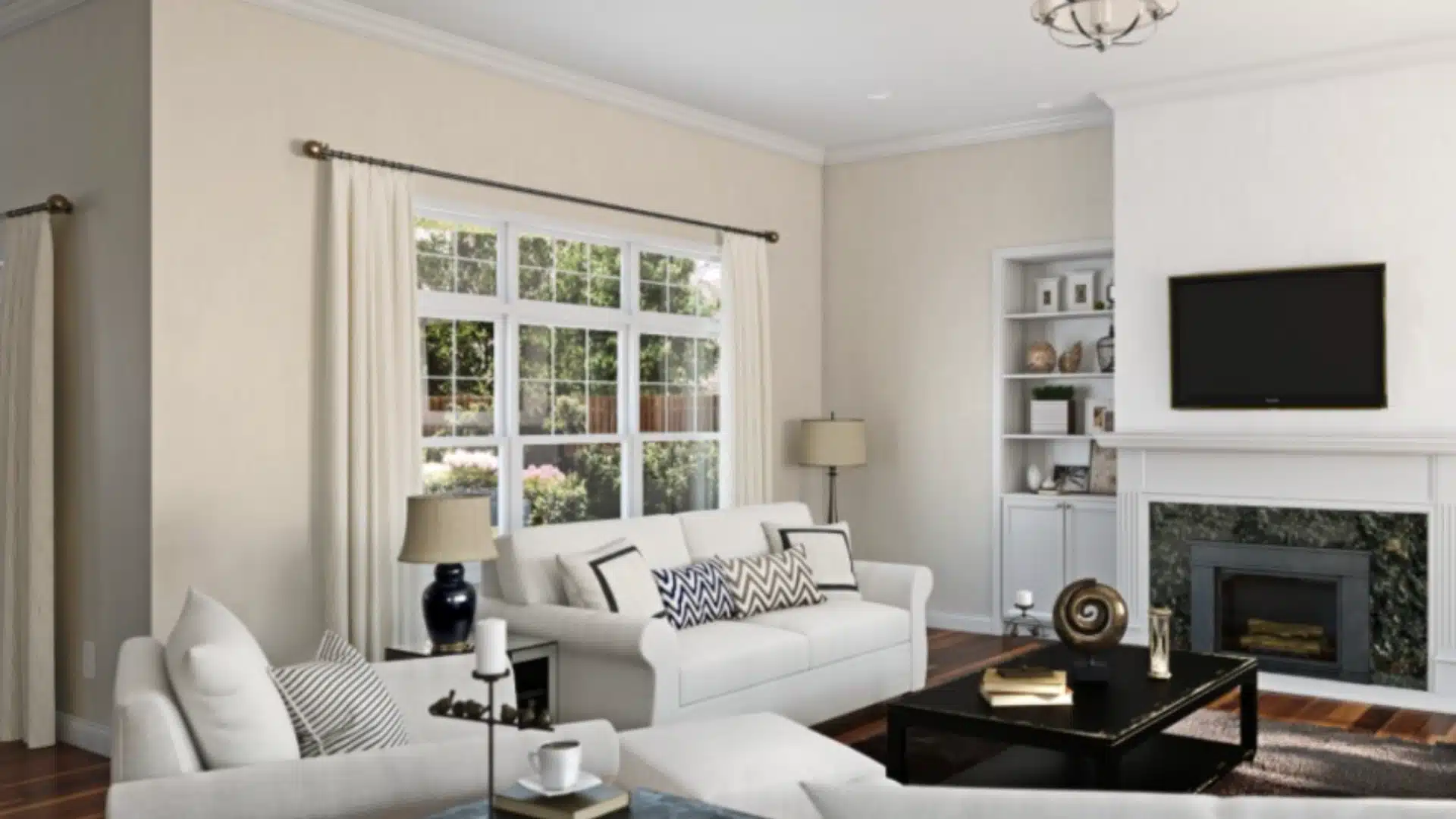 A modern living room showcasing white furniture and a fireplace, designed for relaxation and comfort