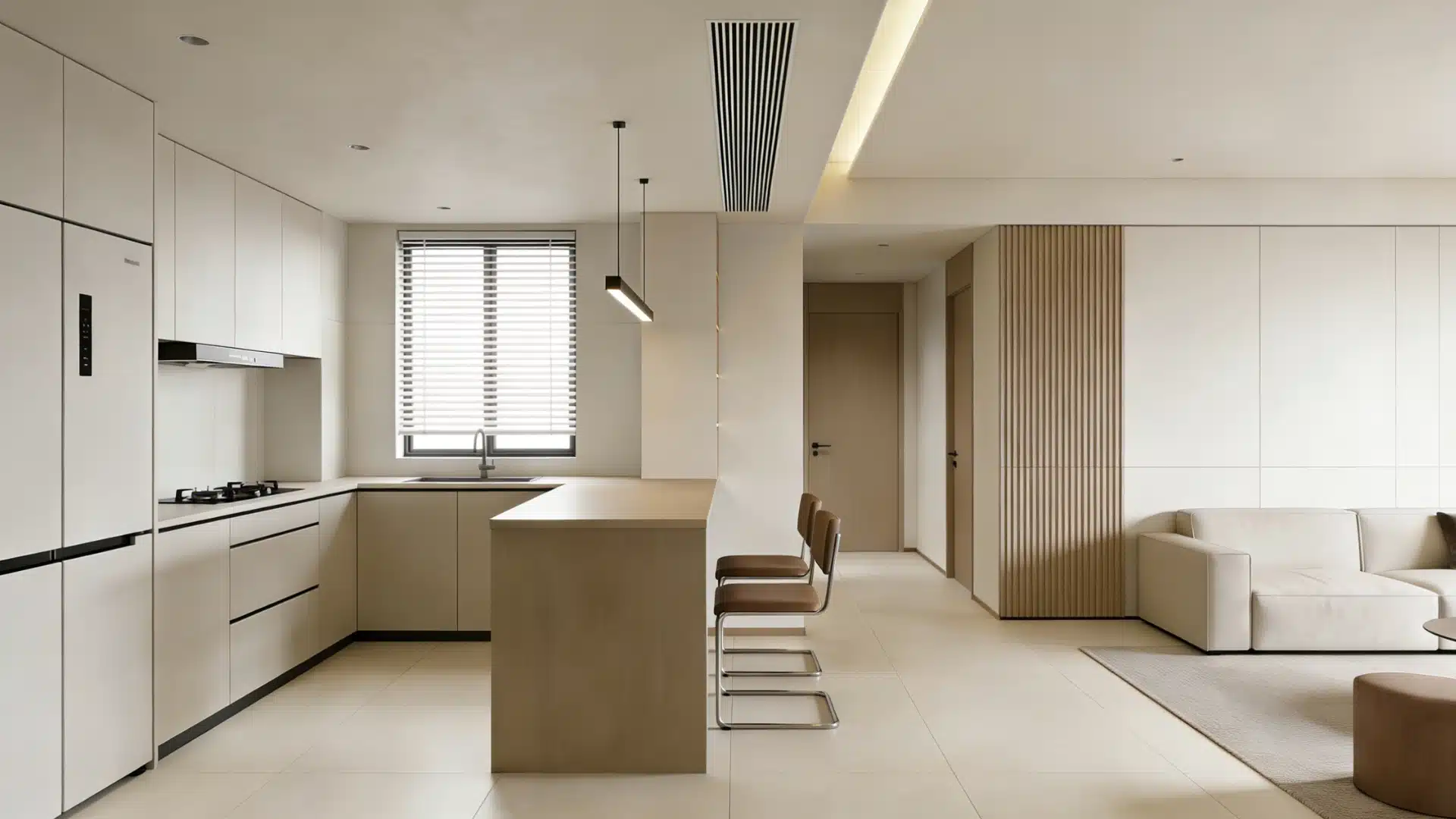 Open plan kitchen and living area featuring peninsula island with bar stools, and light neutral furnishings