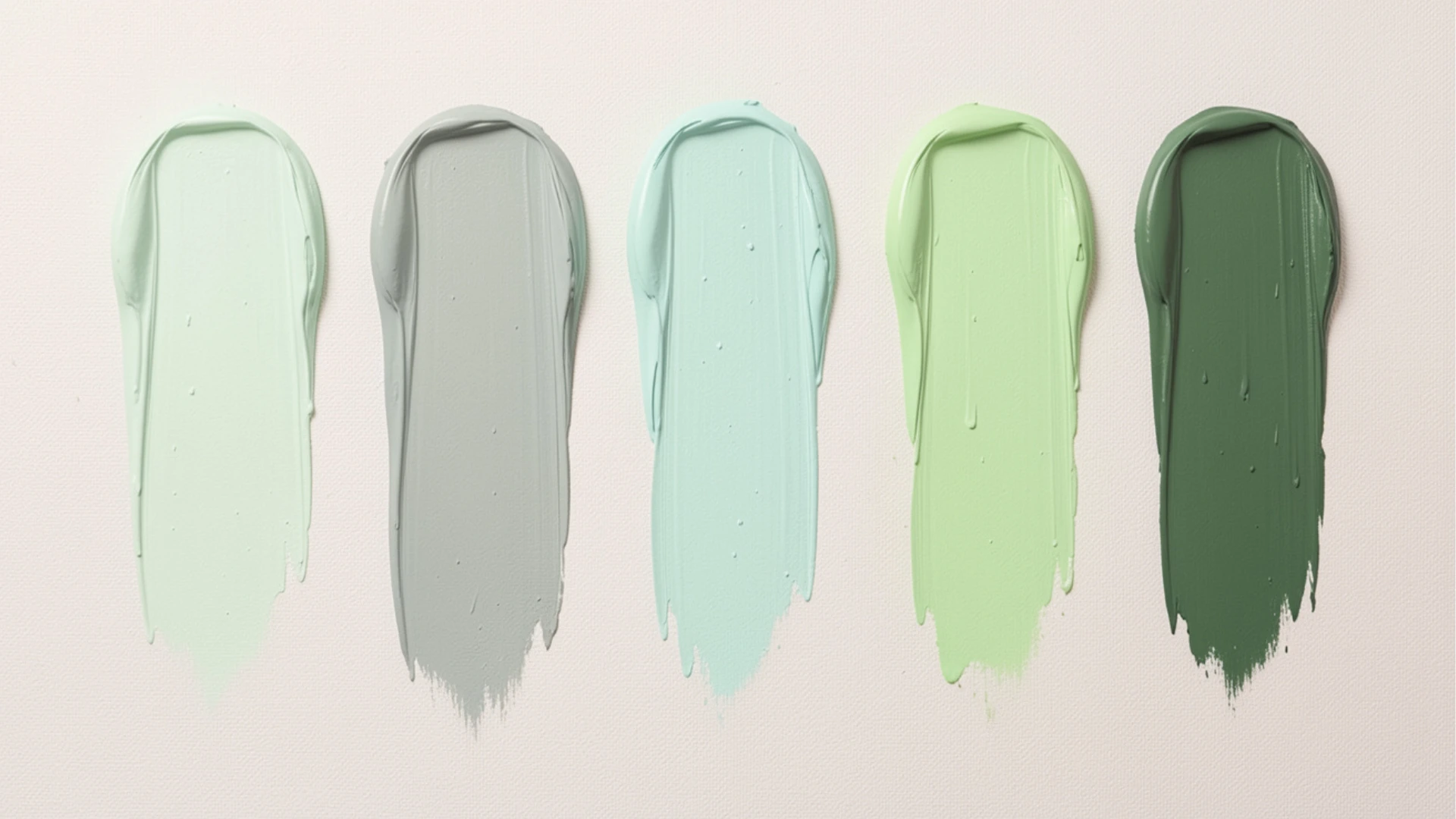 Five swatches of paint show a gradient of greens and grays on a light background