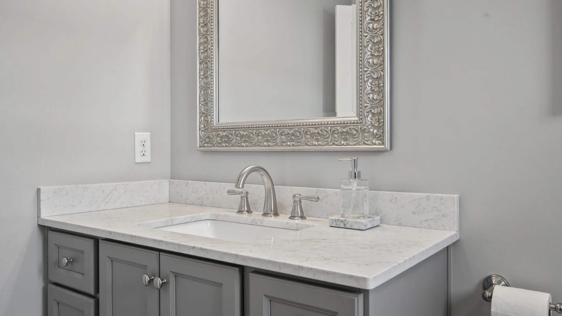 Dolomite bathroom vanity countertop with a sink and framed mirror