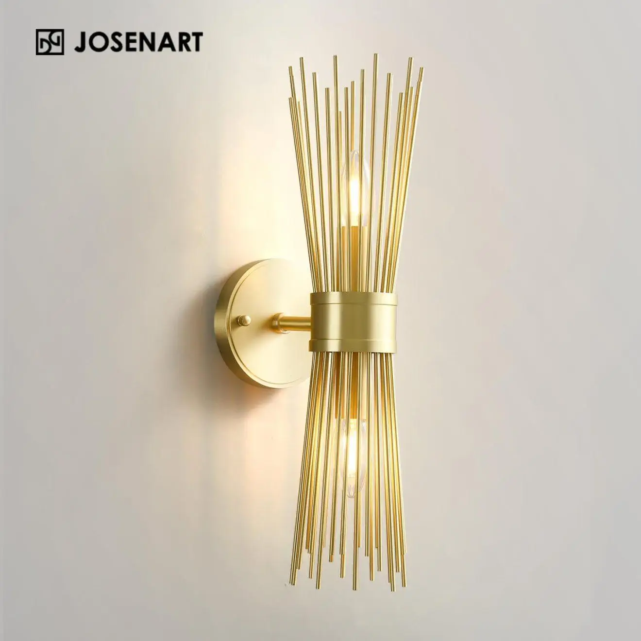 Gold metal wall sconce with vertical rod design on plain white wall