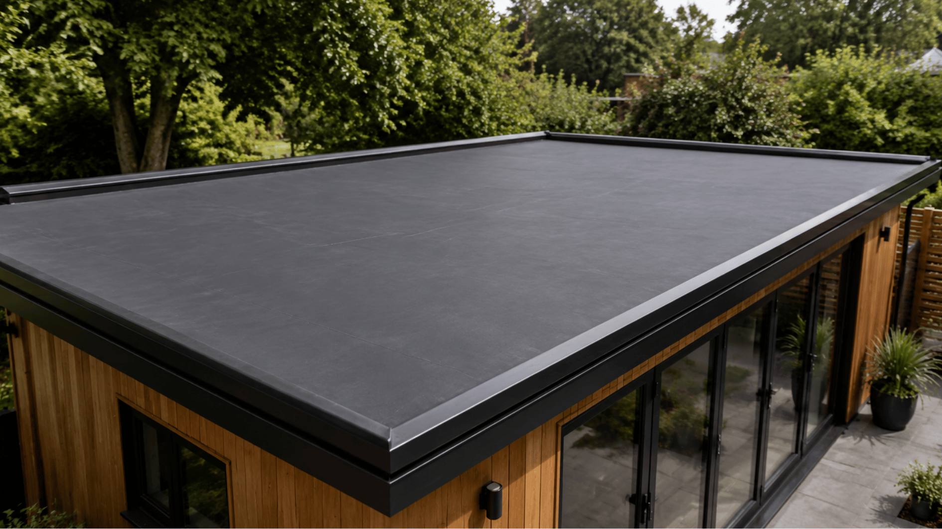 modern epdm flat roofing system on a contemporary american home with clean black surface finish