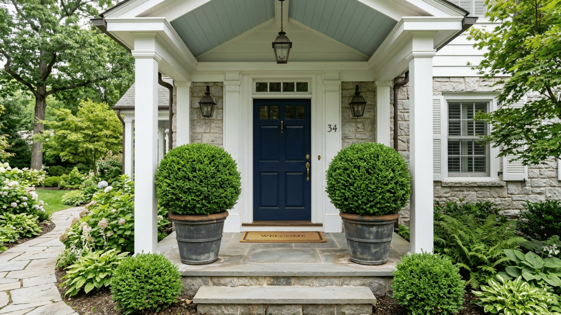 matching potted boxwoods flanking the front entry
