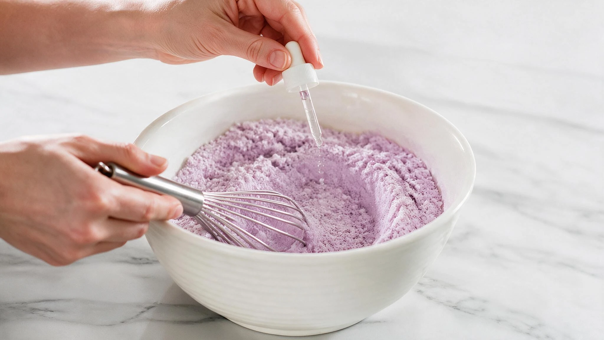 Adding liquid slowly to purple bath bomb mixture while whisking