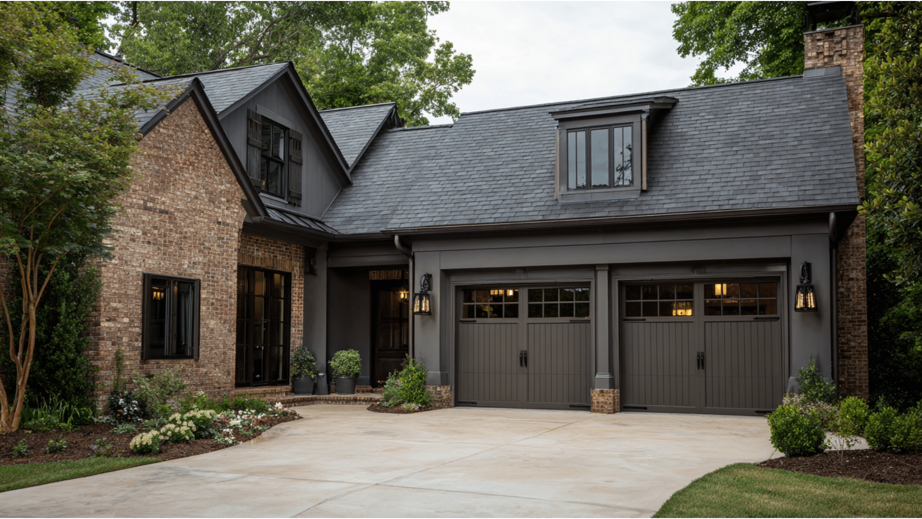 Urbane Bronze garage doors paired with brick siding and dark exterior trim