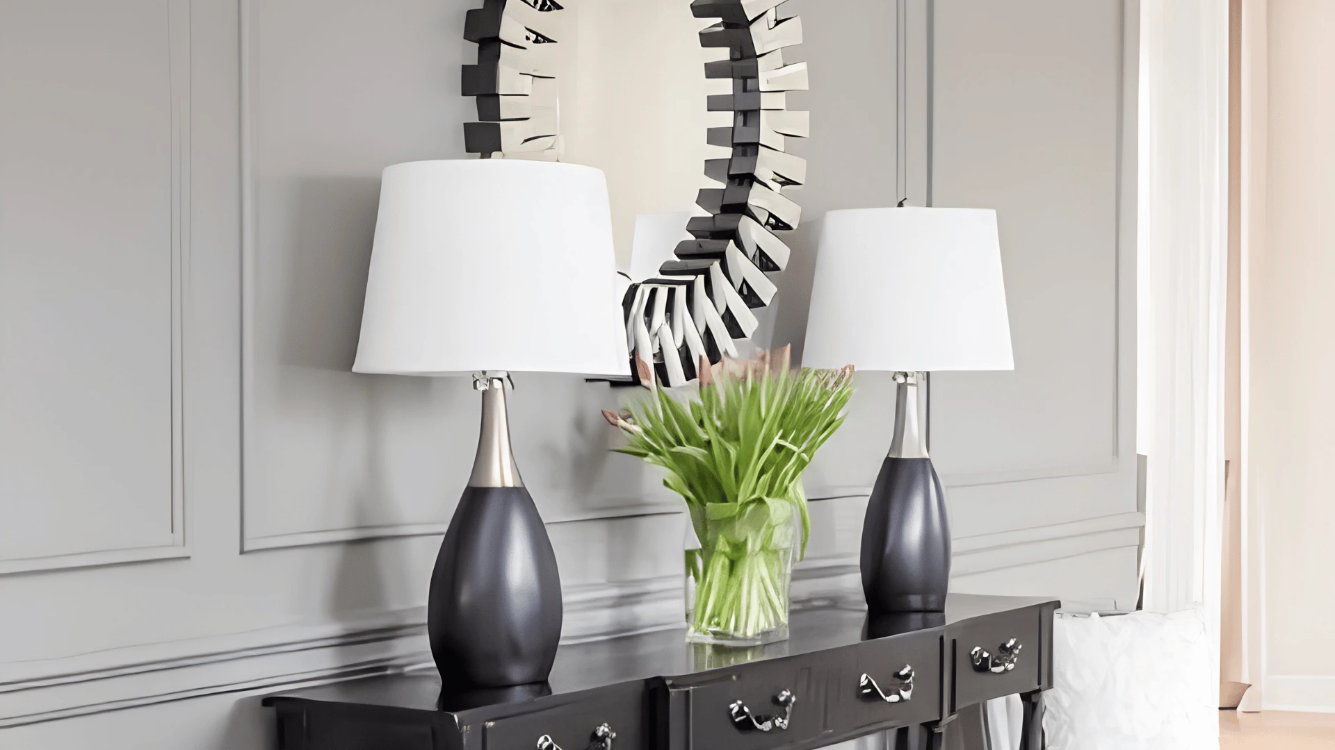Sherwin-Williams repose gray wall with black console table, lamps, and mirror.