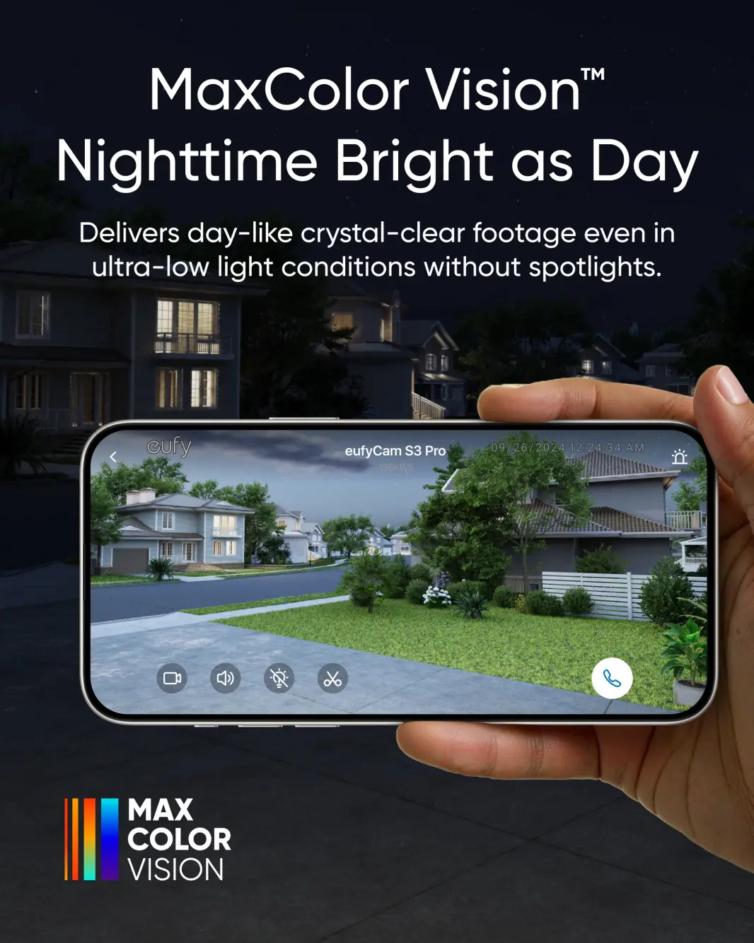 Hand holding smartphone displaying clear night vision of suburban neighborhood houses and greenery