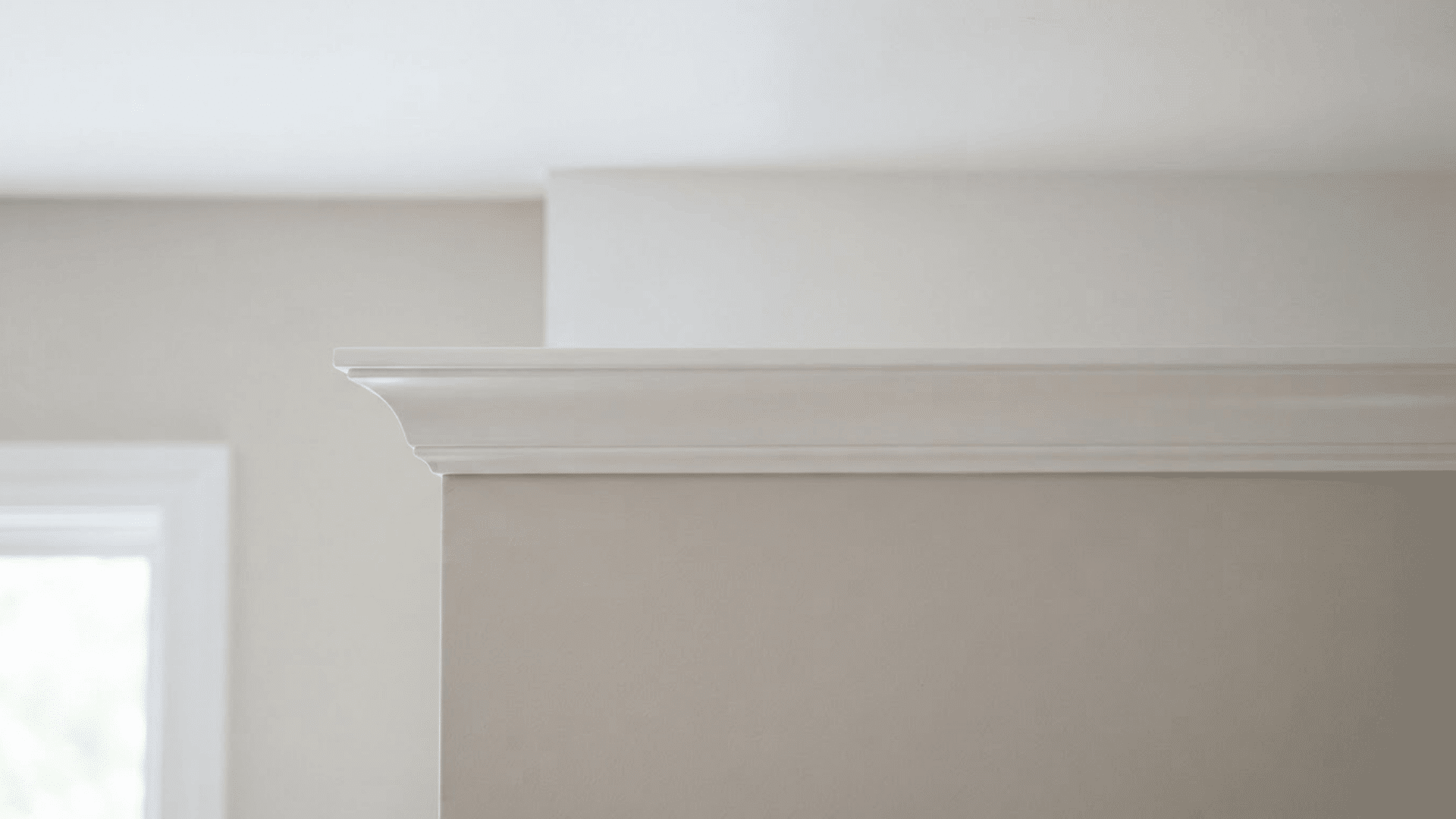 simple crown molding with clean white trim creating a smooth wall-to-ceiling transition