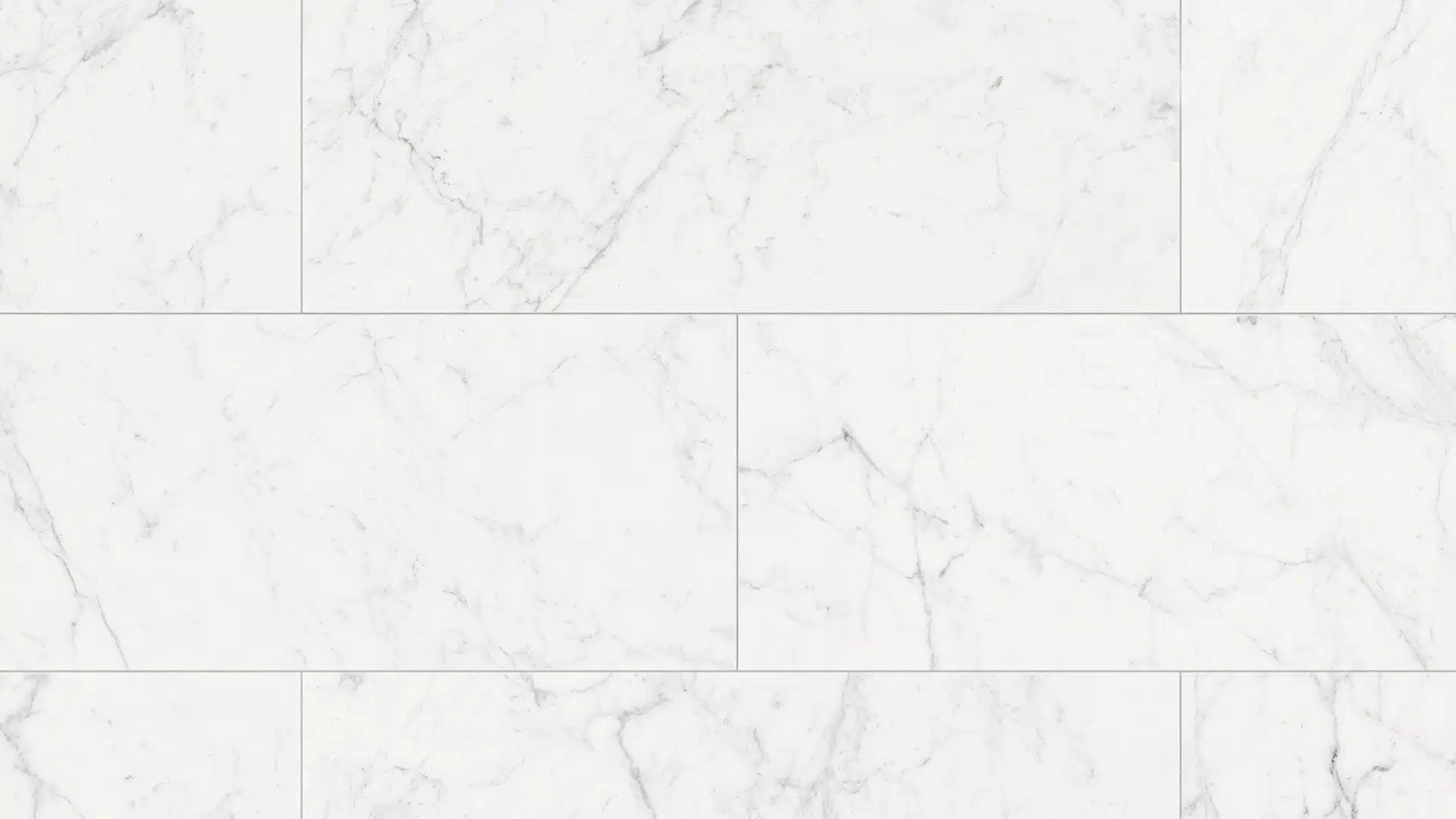 White marble tile layout with subtle grey veining and matching white grout lines.