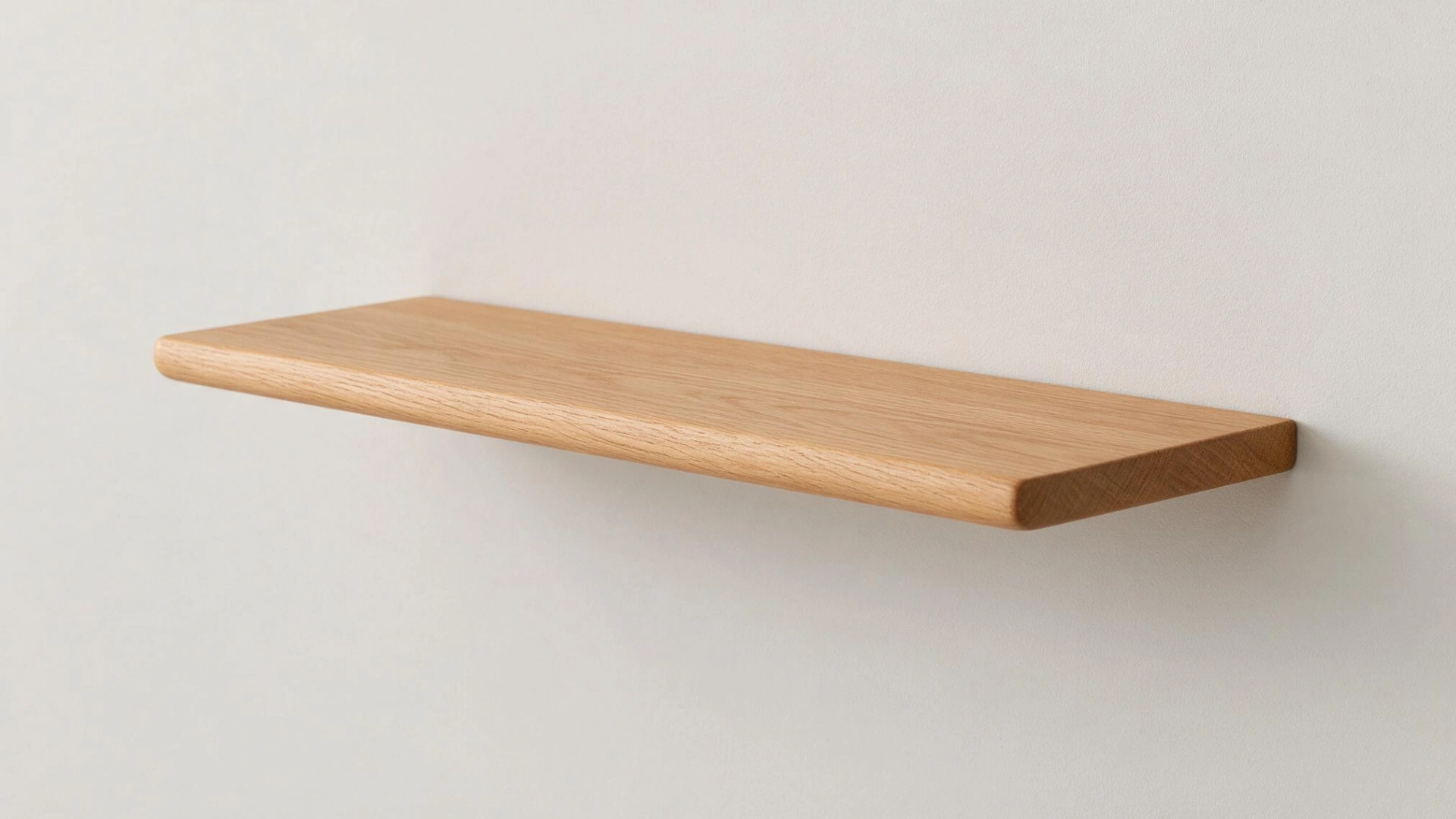 Thin wooden shelf with recessed back groove aligned with a horizontal wood cleat mounted on the wall.